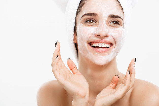 beautiful caucasian woman face portrait applying cream mask her facial skin white background 1258 2235