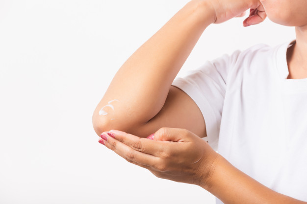 woman applies lotion cream her elbow 143683 417
