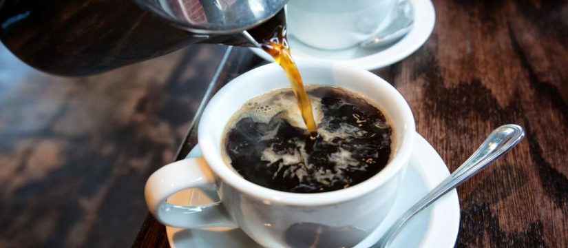 coffee being poured in a cup